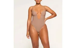 Skims Skims Deep Plunge Strapless Thong Shapewear Bodysuit Thong Clay In Clay