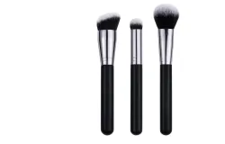 Three black make-up brushes