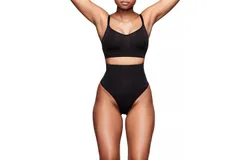 Skims Seamless Sculpt Mid Waist Thong In Onyx