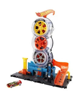 Conjunto de Pistas de Coches de Juguete Hot Wheels City Super Twist Tienda de Neumáticos con Coche a Escala 1:64